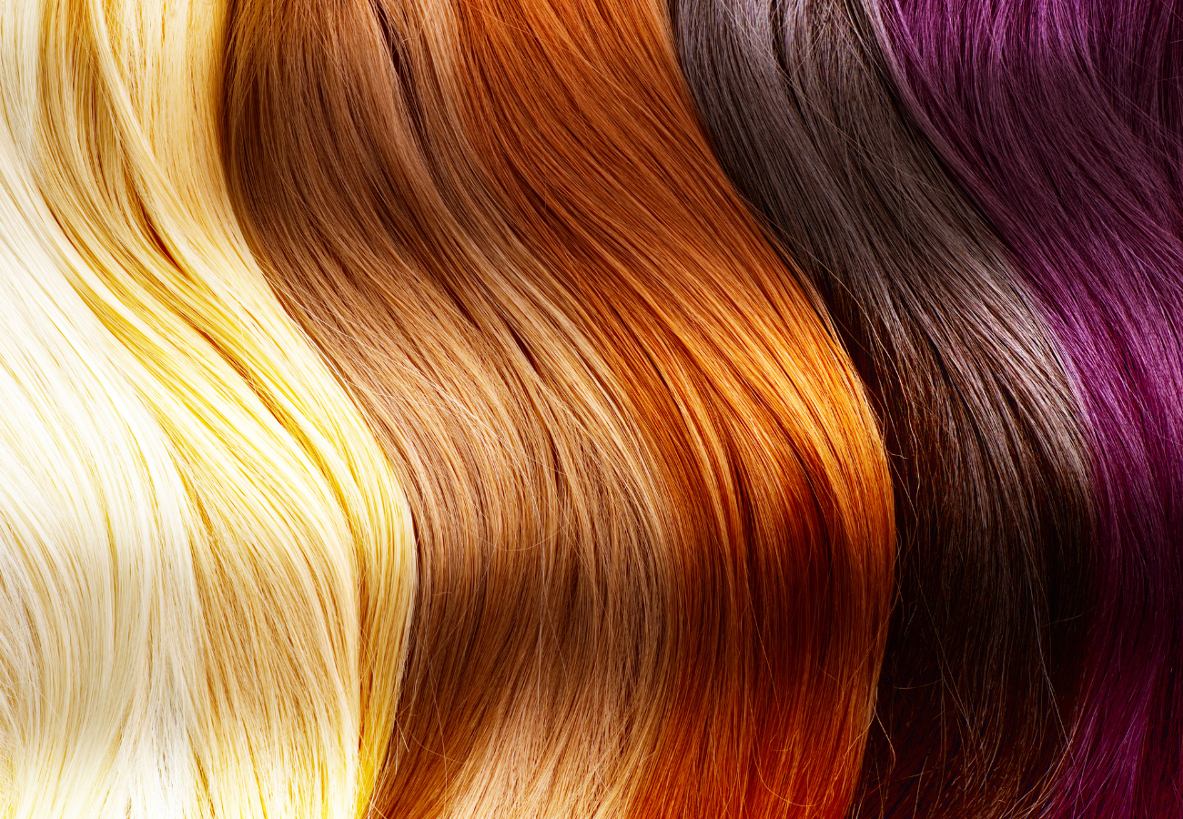Image of blonde, brown, and red hair on Eldorado's hair restoration service website