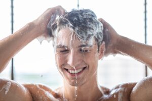 A man shampooing his hair.