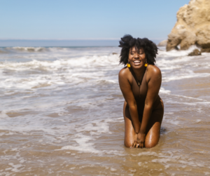Image of a happy woman on a beach