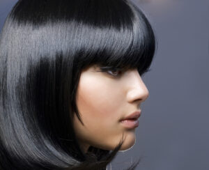 Image of a woman with a black curtain bangs bob