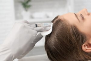 Image of a hair restoration procedure being conducted by a professional on Eldorado's website