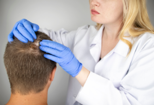Image of a hair restoration professional working with a client
