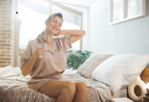 Image of a woman sitting on a bed