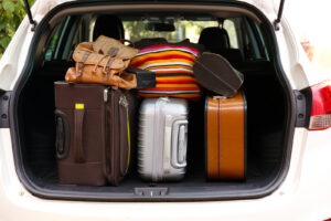 Image of luggage in the trunk of a car