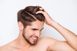 man happy with his hair after transplant