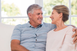 A couple smiling at one another